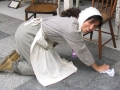Woman scrubbing floors