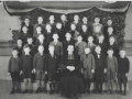 Class photo with a member of the clergy, 1945 in Abitibi