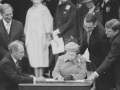 Pierre-Elliott Trudeau and Queen Elizabeth II signing the Canadian Charter of Rights and Freedoms